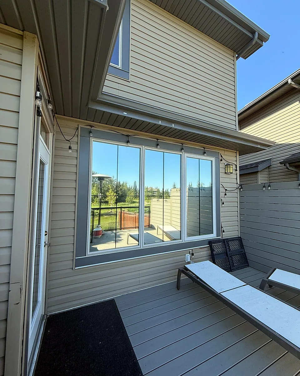 Large patio windows with film, seen from a back deck
